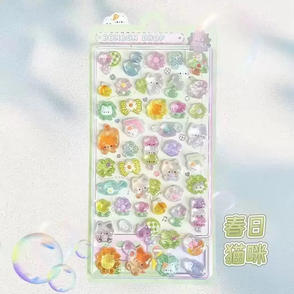 Main product photo — BONBON DROP pastel sticker sheet with kawaii cartoon animals and icons

Close-up sheet — Puffy glossy stickers featuring cats, bears, birds, fruits, and musical notes

Detail shot — Jelly‑like 3D stickers with pastel colors and text phrases like “PIYO” and “MAOI”

Lifestyle flat lay — Decorative BONBON DROP sticker sheet with bubbles and whimsical background

Color detail — Pastel kawaii stickers with glossy finish and playful cartoon characters

Thumbnail image — BONBON DROP kawaii puf
